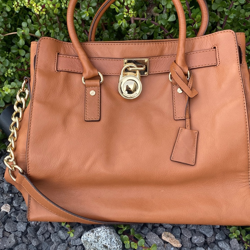 Michael Kors slightly used.. Leather light Brown.. plenty of room inside..